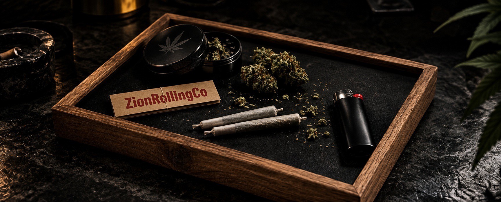 Zion Rolling Co walnut tray styled with papers, grinder, flower and lighter on dark stone